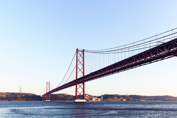 Fototapeta na wymiar The 25 de Abril steel suspention bridge in Lisbon