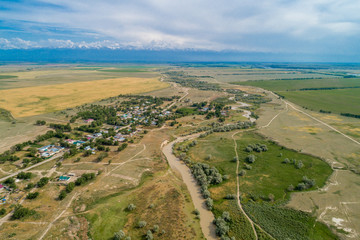 A beautiful view of the forest, fields and river from above. Drone photography of the city