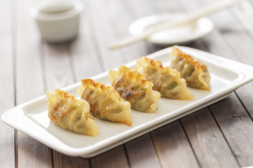 Pan Fried Dumpling, with sauce. Asian food. 