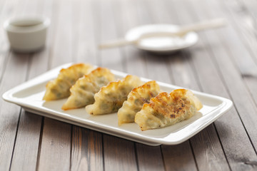 Pan Fried Dumpling, with sauce. Asian food. 