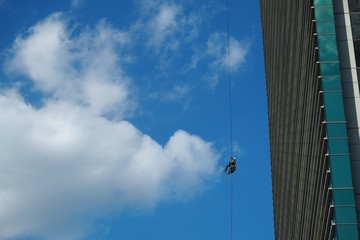 Industrial climber against the blue sky.