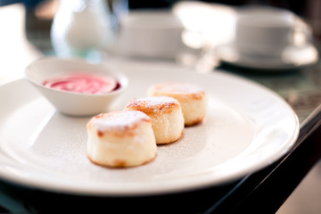 Syrniki on the white palte