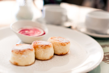 Russian syrniki or sirniki, cottage cheese pancakes