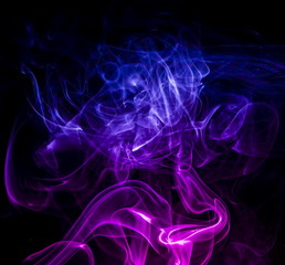 Colored smoke on black background