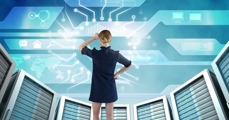 Woman with computer servers and technology information interface