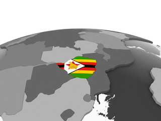 Zimbabwe with flag on globe