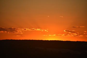 dramatic orange sunset on top of a mountain