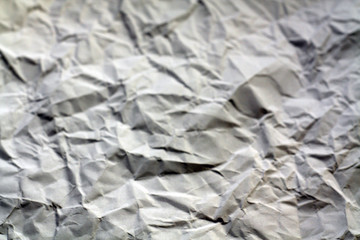 Crumpled sheet of paper with blur effect.