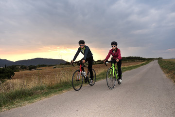 Fototapeta na wymiar cycling couple on a road