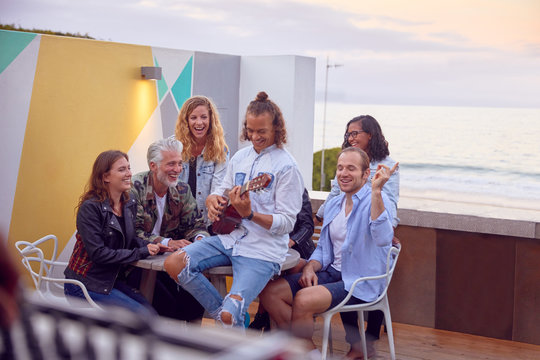 Friends at party by beach, Plettenberg Bay, Western Cape, South Africa