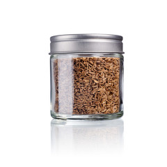 Caraway seed in a glas with metal lid, isolated on white