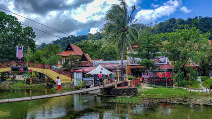 Fototapeta premium A small village and river and walking people in forests, Langkawi, Malaysia