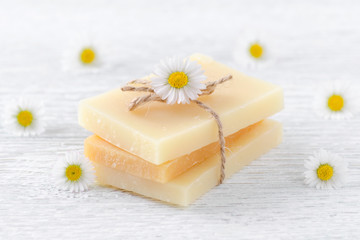 handmade organic chamomile soap bar with fresh chamomile flowers