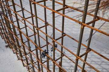 Steel reinforcement bar and timber form works at construction site on blue sky background