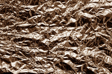 Metal foil texture in brown tone.