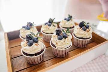 a concept of baking sweet cupcakes and muffins at home