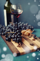blue grapes and vine in the glass
