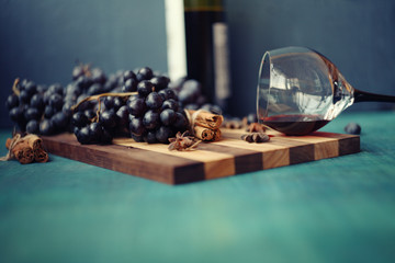 blue grapes and vine in the glass