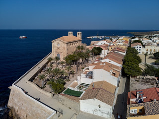 Fototapeta na wymiar church of St Peter and St Paul and townscape of Tabarca Island. Spain