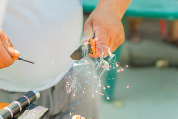 Cutting sparks from flint and flint. Demonstration of obtaining fire with a knife and flint.