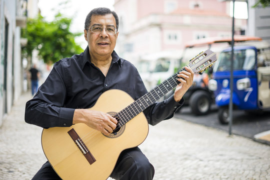 Aoustic guitar player on the street of Alfama in Lisbon, Portugal