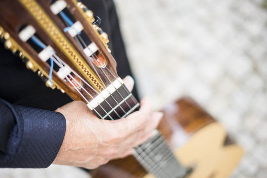 Musician holding his acoustic guitar