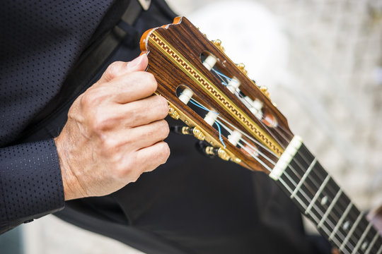 Musician holding his acoustic guitar