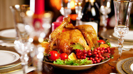 Fototapeta na wymiar Closeup image of tasty roasted chicken on Christmas dinner table