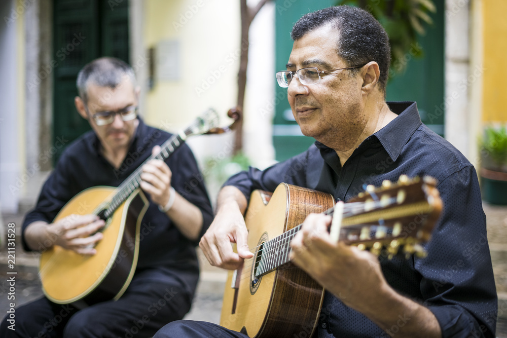 Wall mural Two fado guitarists with acoustic and portuguese guitars