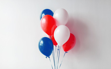 holidays and decorations concept - red, white and blue air balloons for 4th of july or birthday...