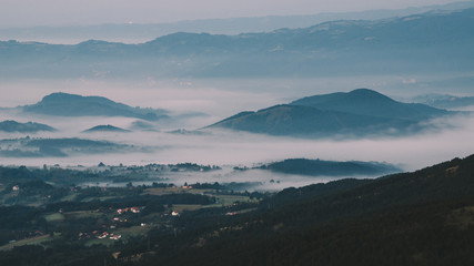 View on a hills in the valley in a morning mist