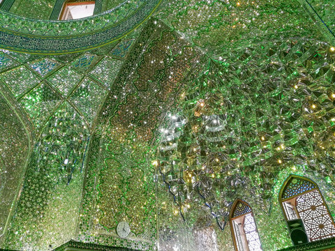 Persian interior mirror mosaic work of Shah-e-Cheragh shrine and mausoleum. Shiraz, Iran.