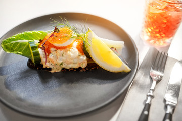 food, new nordic cuisine, culinary and cooking concept - close up of toast skagen with shrimps, fish roe and buttery bread on plate