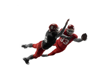 Active two american football player isolated on white background. Fit caucasian men in uniform with...