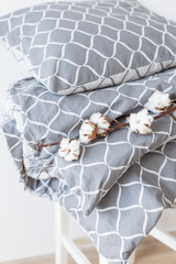 Modern grey bed linen pile, in trend, minimalism clean home concept