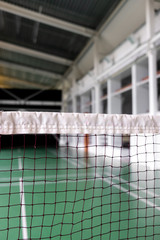 Beautiful volleyball grid playing on on a sport hall background. Close-up