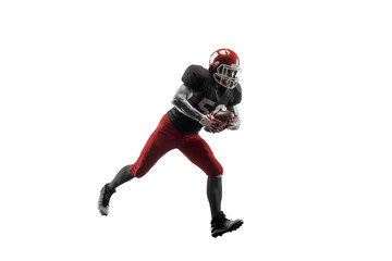 Obraz na płótnie Canvas Active one american football player isolated on white background. Fit caucasian man in uniform running over studio background in jump or motion. Human emotions and facial expressions concept