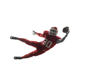 Active one american football player isolated on white background. Fit caucasian man in uniform...