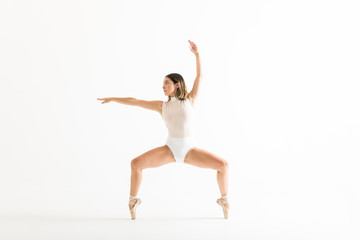 Fototapeta premium Energetic Female Dancer Performing Ballet Squat
