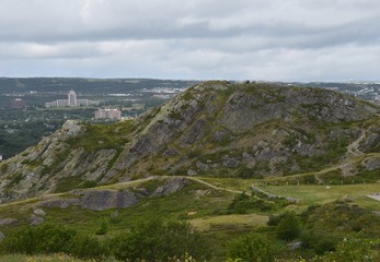 Fototapeta na wymiar view of the Summer rocky hill landscape on Signal Hill National Historic site, St John's Newfoundland Canada 