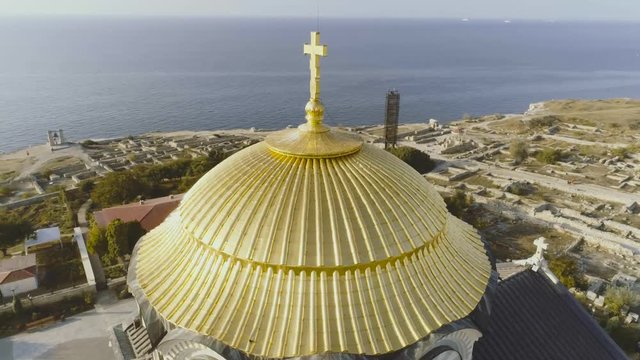 Famous church and landmark. Shot. Close up of golden yellow domes on blue sunny sky background at summer season