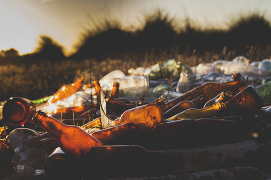 A Pile Of Empty Glass Bottles Waste In The Countryside