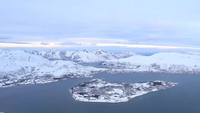 Aerial view over the snowy mountains of Northern Norway near Tromso