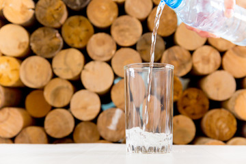 Glass of pure water on a white kitchen table