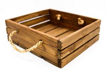 Empty retro dark brown wooden box with rope on white background