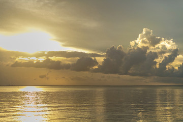 Golden Clouds on the Sea at Sunset