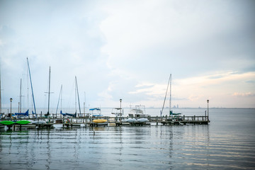 Fototapeta na wymiar Sailboats at Pier At Sunset in Fairhope, Alabama