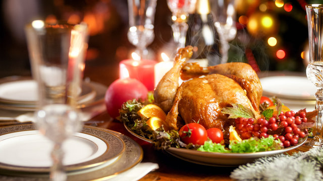 Closeup image of hot freshly baked turkey on family festive dinner