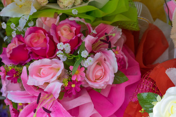 Rose fake flower and Floral background. rose flowers made of fabric. The fabric flowers bouquet. Colorful of decoration artificial flower