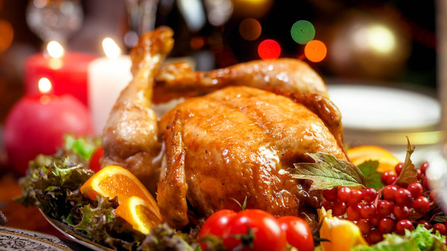Closeup image of family christmas dinner with baked chicken